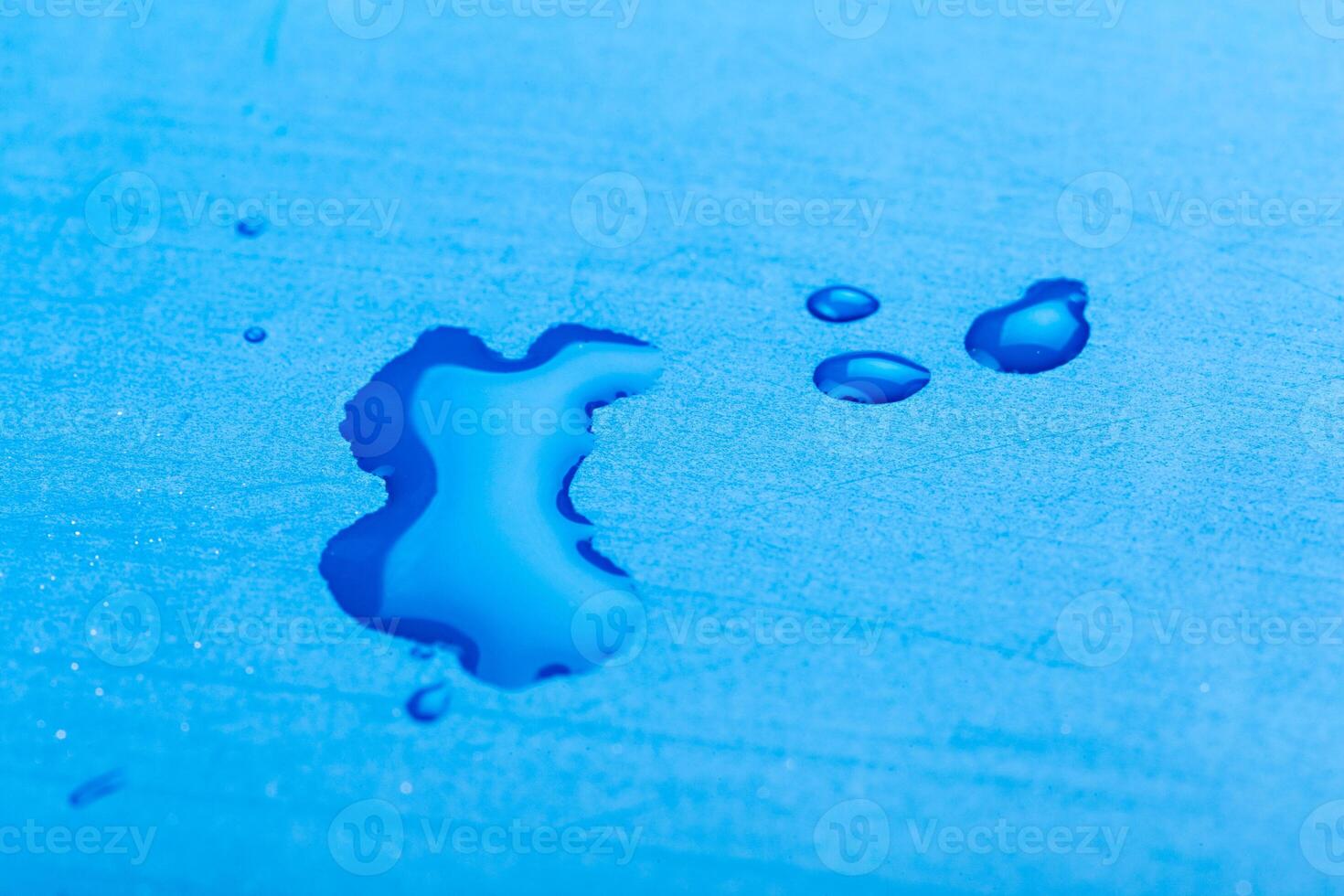 water drop on surface of fresh blue background photo