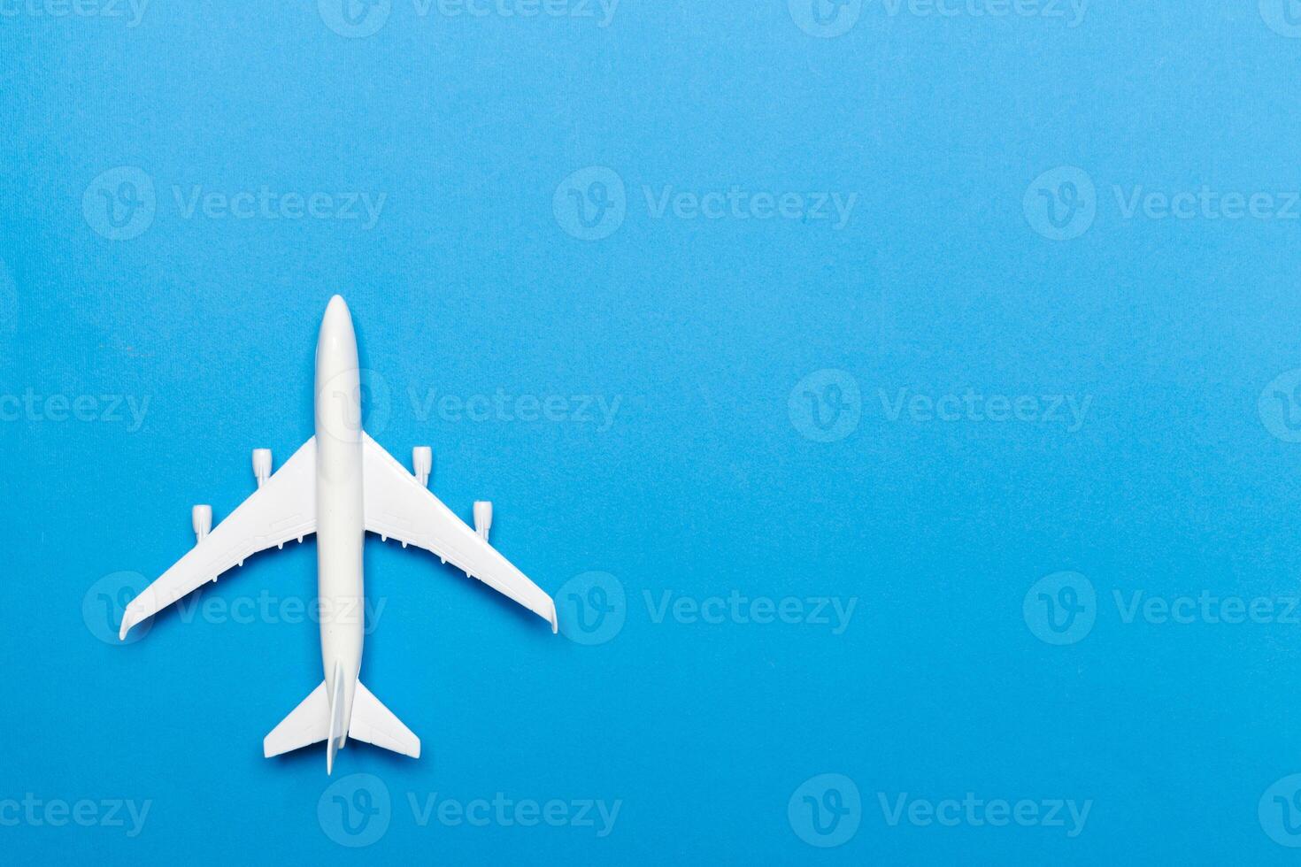 model of passenger plane on blue background photo