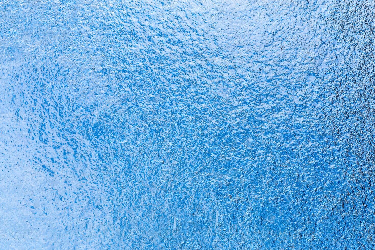 Frozen ice pattern on glass photo