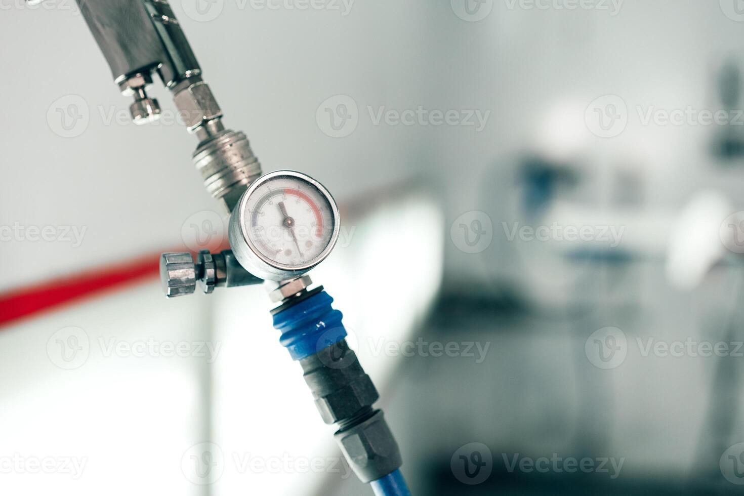 Close-up of a pressure gauge and valve in a medical facility showing precise measurements during an equipment check photo