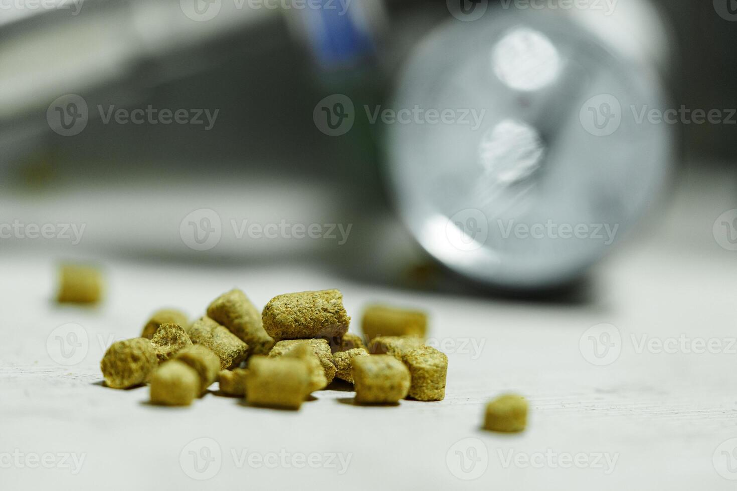 A handful of hops are scattered on a table during the brewing process photo