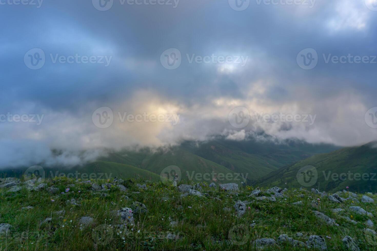 Dramatic clouds in mountains photo