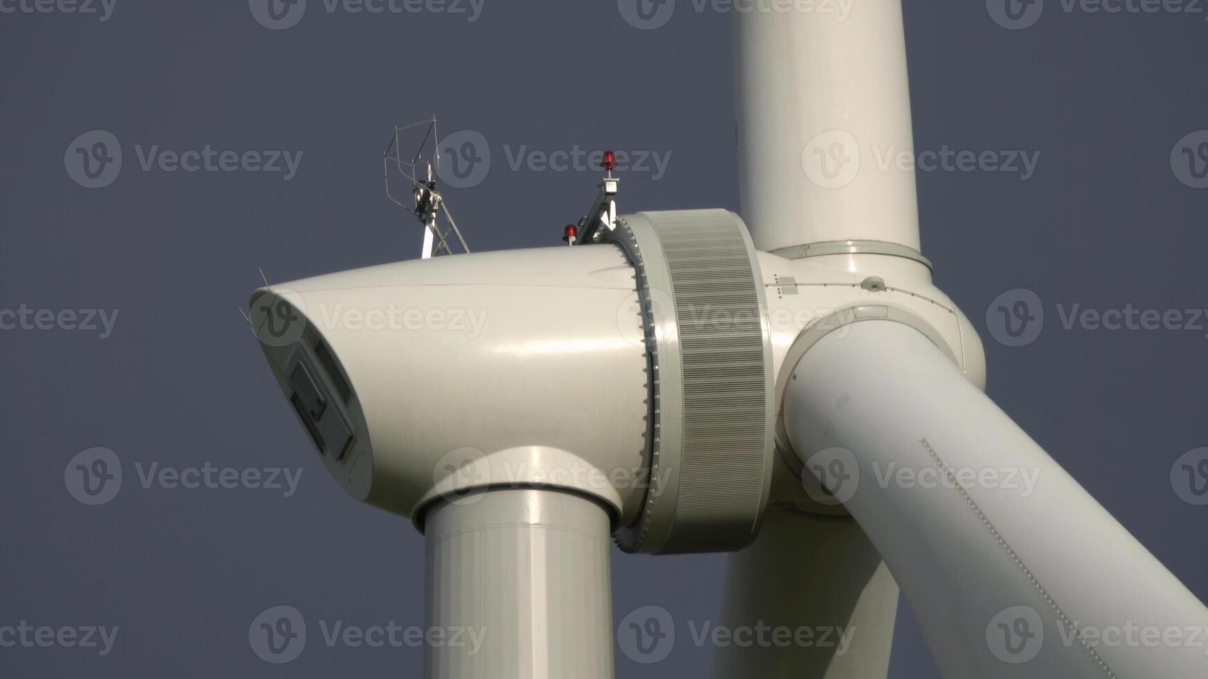 Windmill or wind turbine closeup in rotation photo