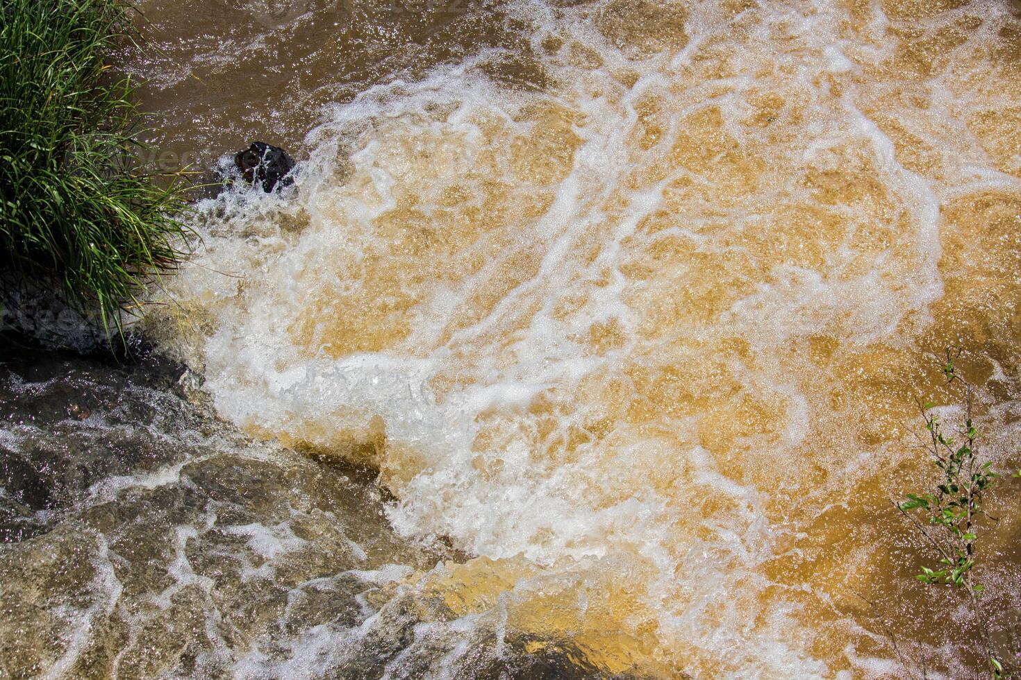 Detail of the force of the water at the edge of the Iguazu Falls, Misiones, Argentina photo