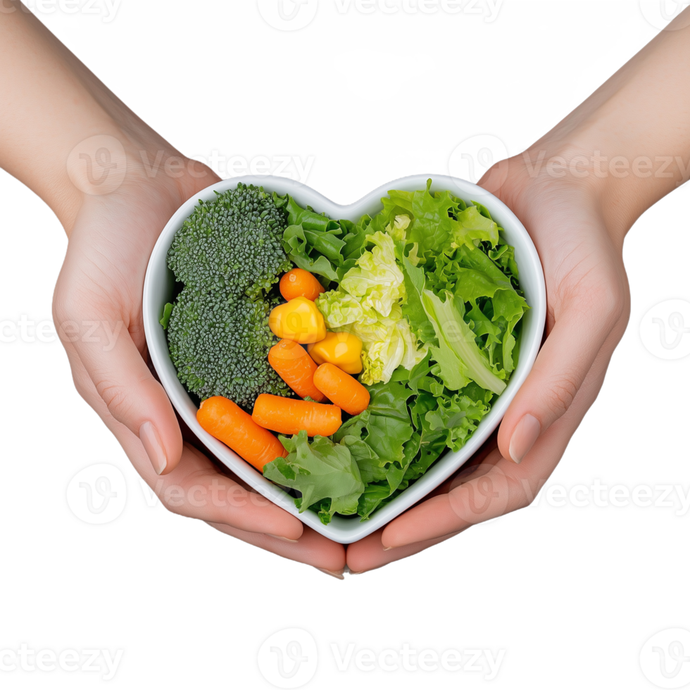 Fresh vegetables in heart-shaped bowl held by hands on transparent background png