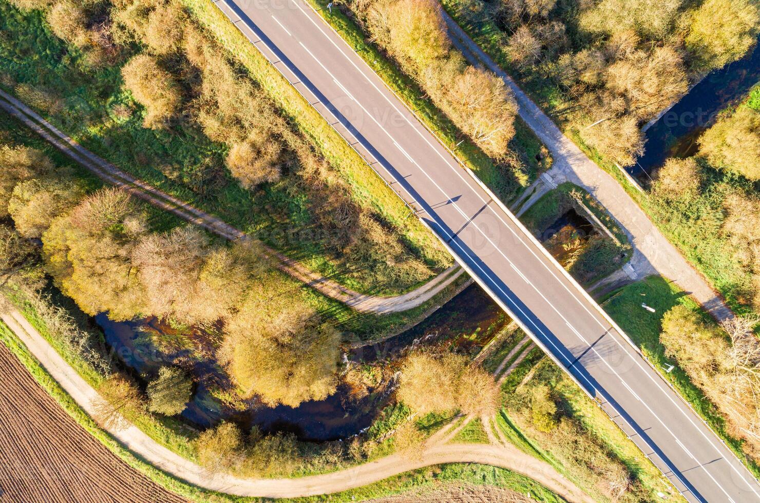 top view with drone of a bridge on a secondary road over a river, aerial photography photo