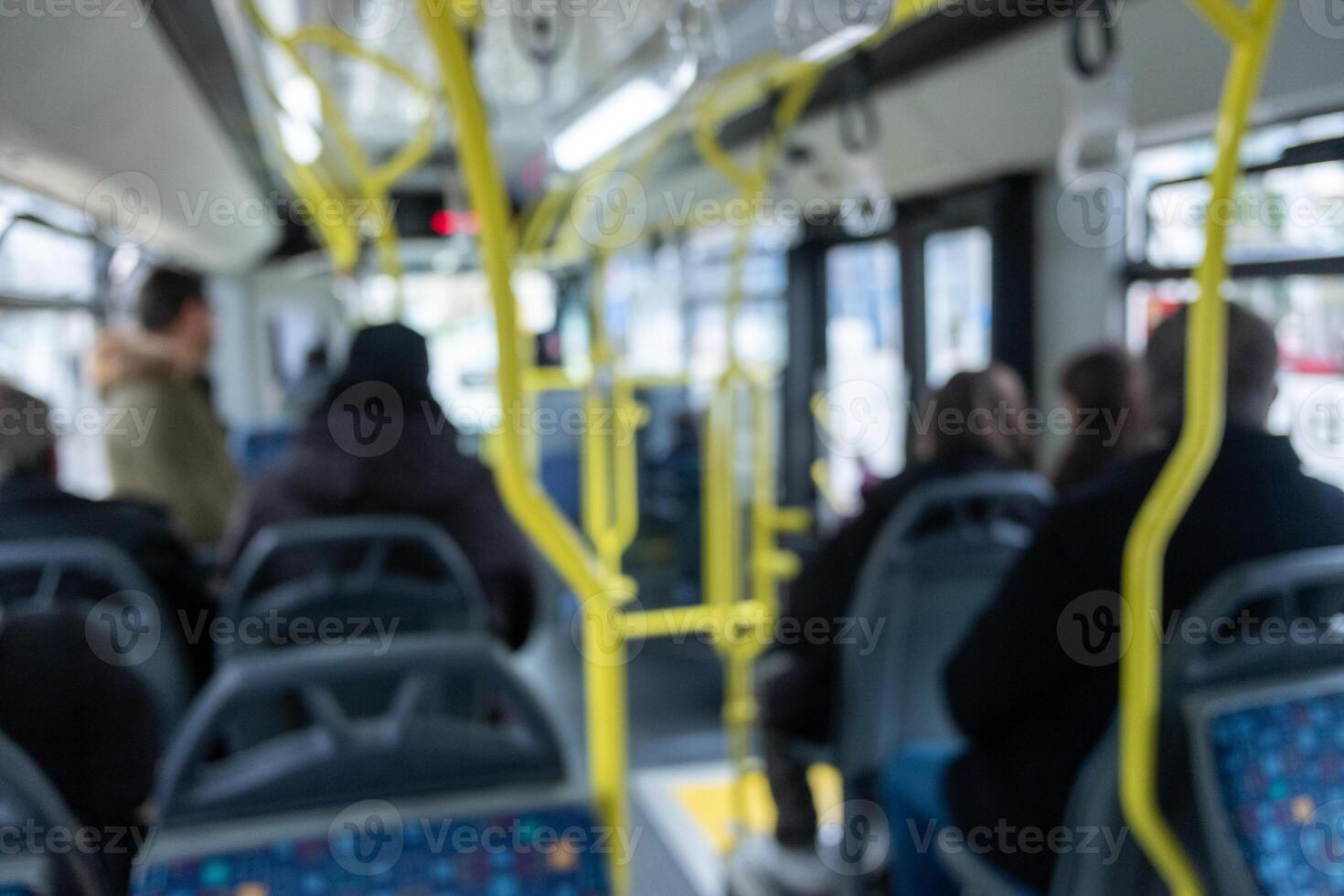 blurred and out-of-focus image of the interior of an urban public transport bus, background photo