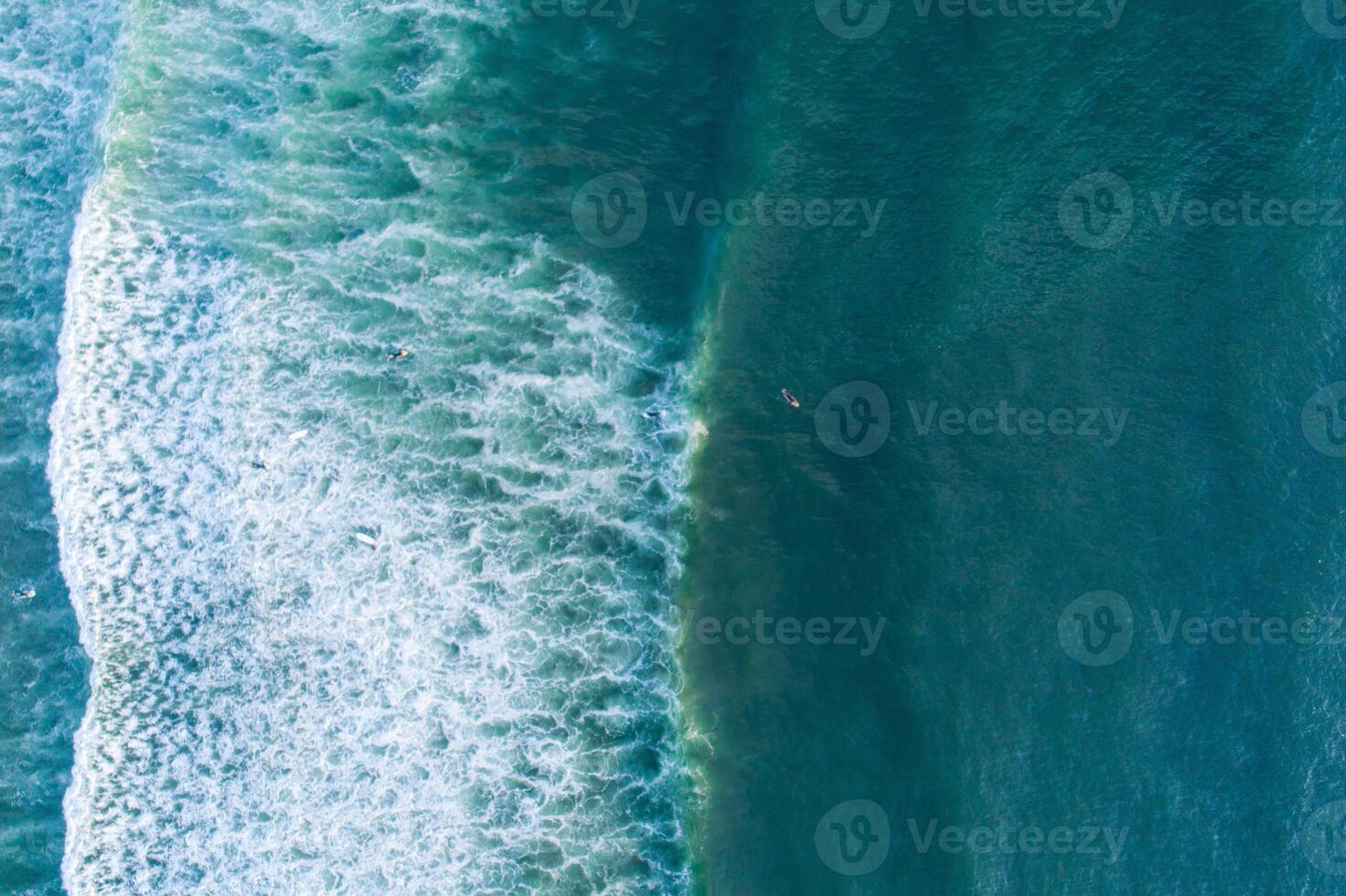 Ocean waves and surfboards aerial perspective surfing scene. Drone zenithal photography, summer sport concept. Holidays background photo
