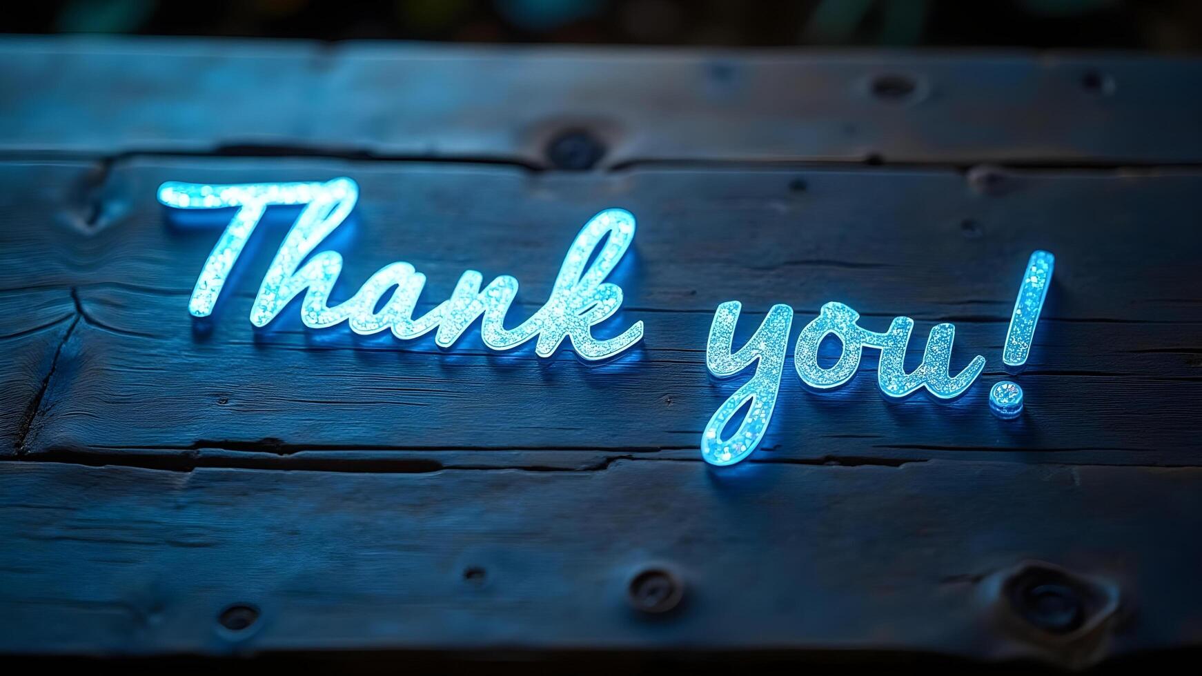 Glowing Thank You Note on Rustic Wooden Surface photo
