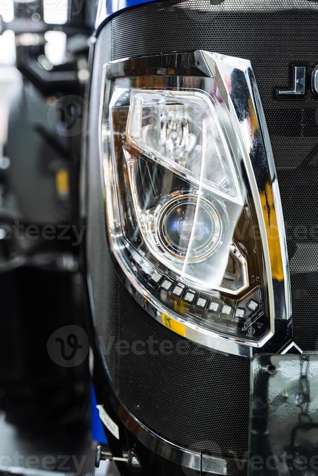 Closeup of tractor headlamp, part of automotive lighting photo