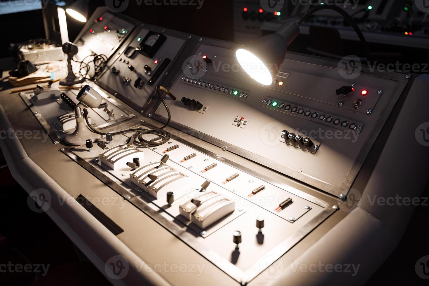 Control panel with numerous buttons and lights for vehicle or machine use photo