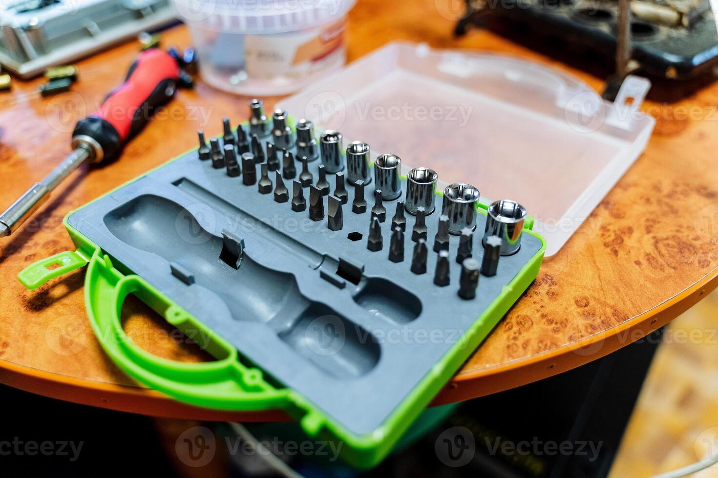 A set of tools. Box with various nozzles for screwdriver. Keys for repair. photo