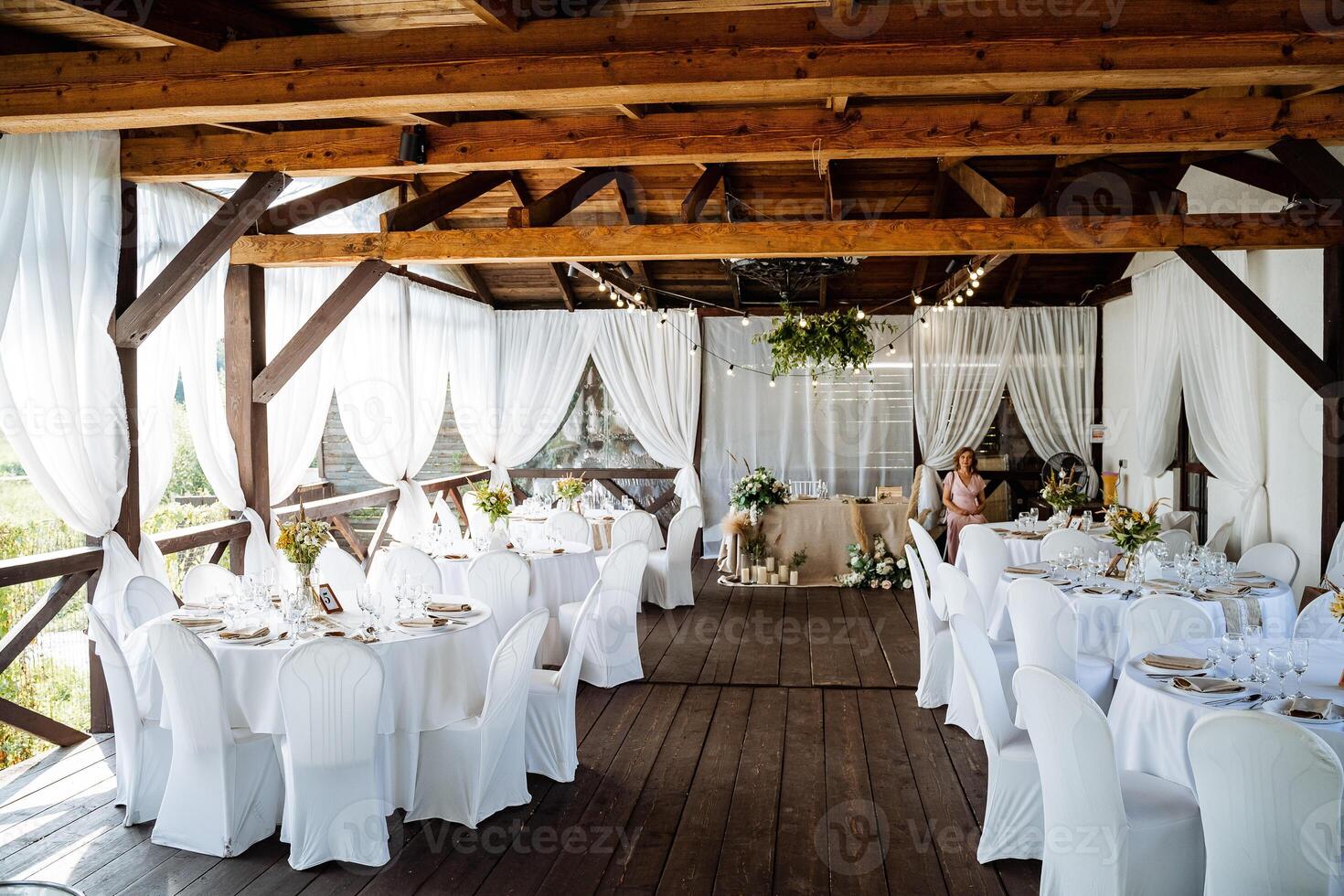 A wedding reception in a rustic setting photo