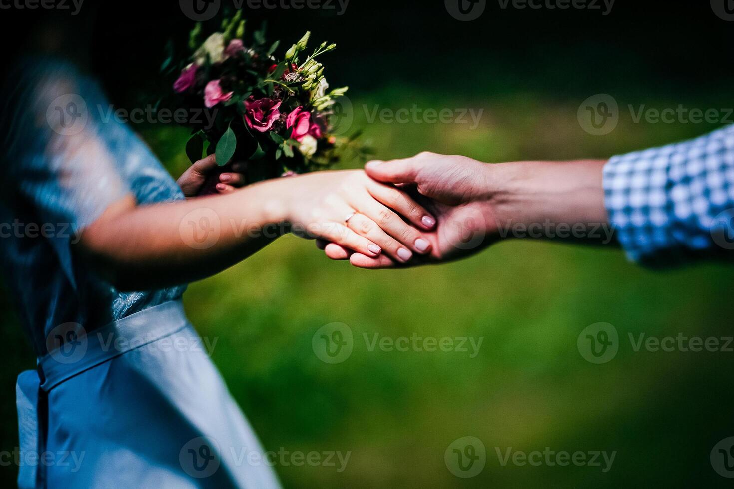 Close-up of a woman and a man holding out their hands, two people holding hands. The symbol is a sign of sincere feelings, a loved one. the concept of true friendship, outdoors photo