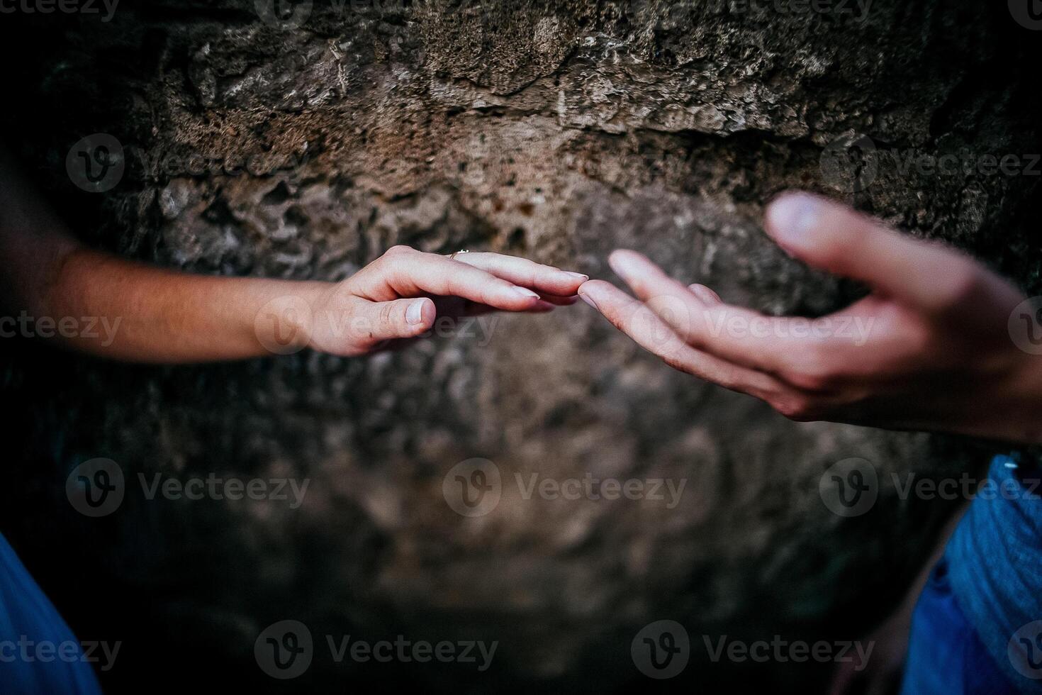 Close-up of a woman and a man holding out their hands, two people holding hands. The symbol is a sign of sincere feelings, a loved one. the concept of true friendship, outdoors photo
