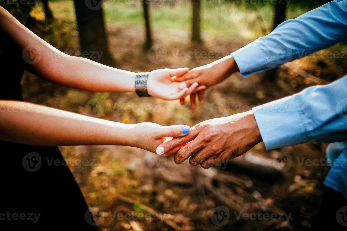 Close-up of a woman and a man holding out their hands, two people holding hands. The symbol is a sign of sincere feelings, a loved one. the concept of true friendship, outdoors photo