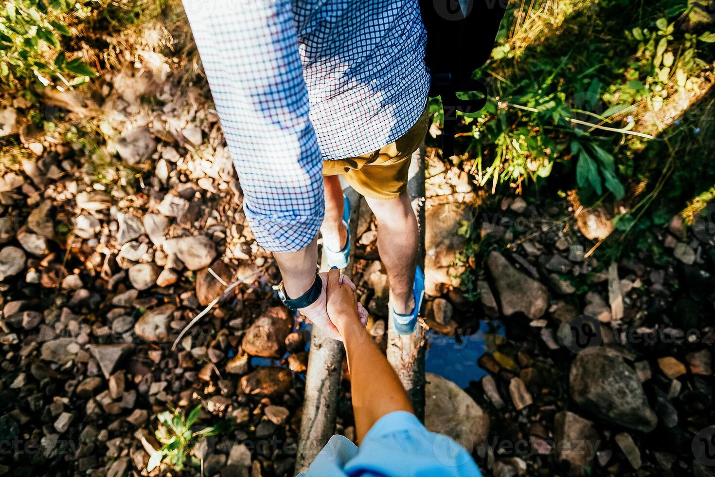Close-up of a woman and a man holding out their hands, two people holding hands. The symbol is a sign of sincere feelings, a loved one. the concept of true friendship, outdoors photo