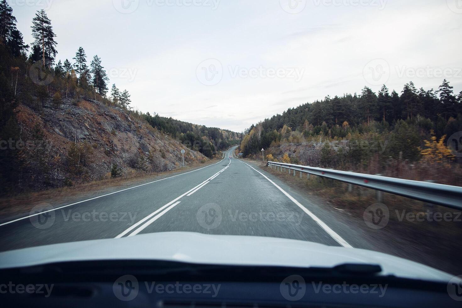Road way asphalt. long highway in the mountains. mountainous terrain. movement goes beyond the horizon photo