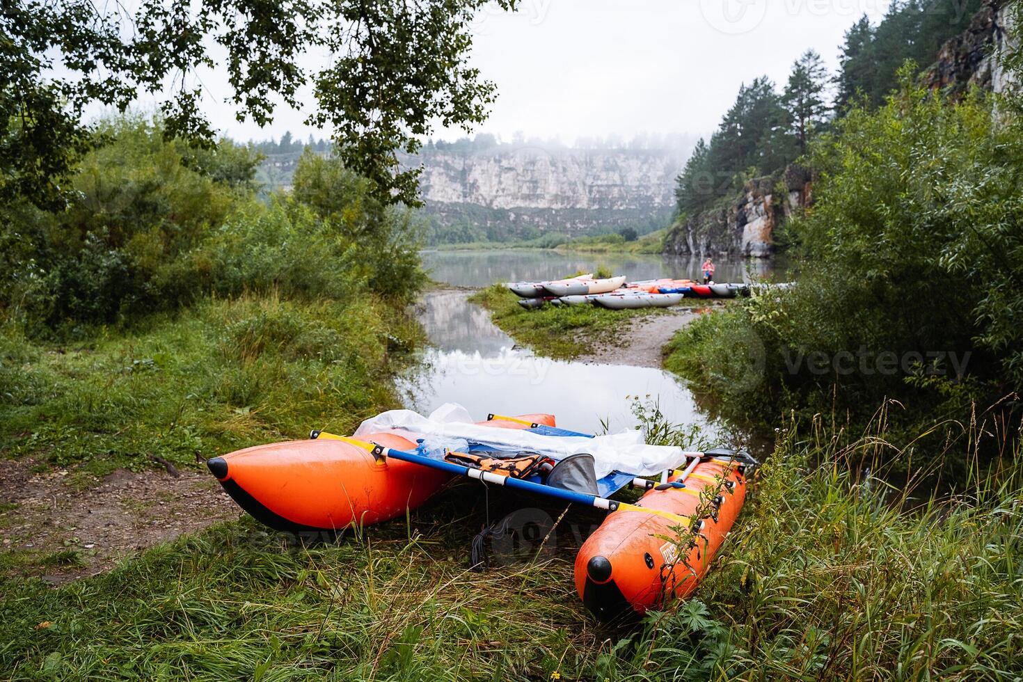 sports catamaran for rafting on mountain rivers, Hiking equipment, inflatable catamaran stands on the river Bank, the concept of outdoor activities. photo