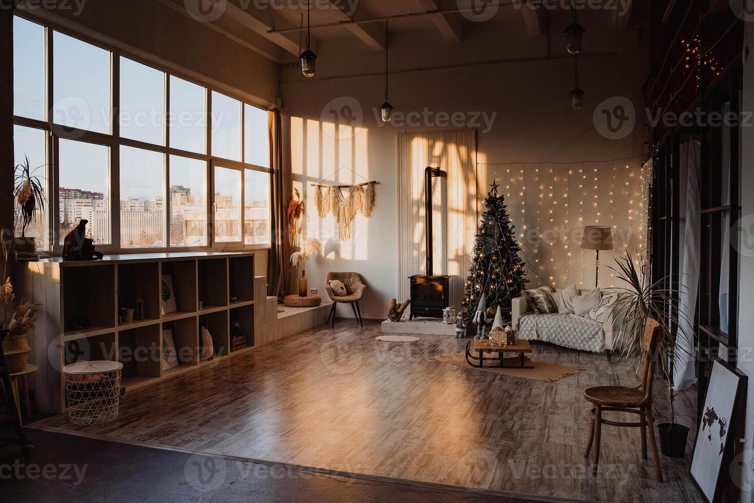 A room with a christmas tree and a couch photo
