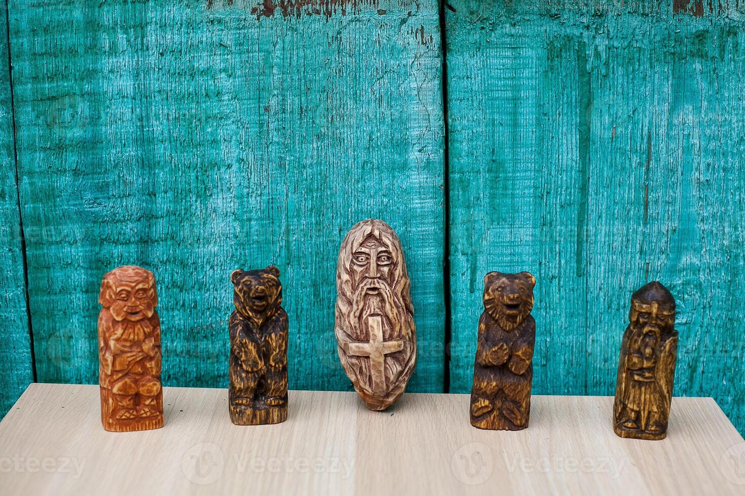 A group of wooden figurines on a wooden table photo