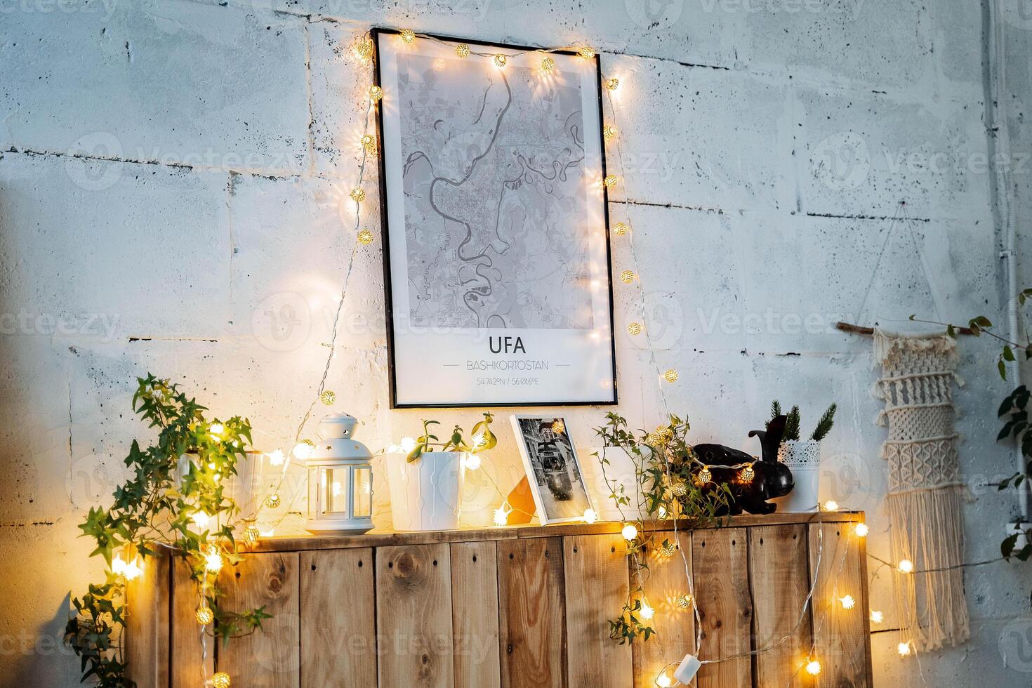 A wooden chest with lights and plants on it photo