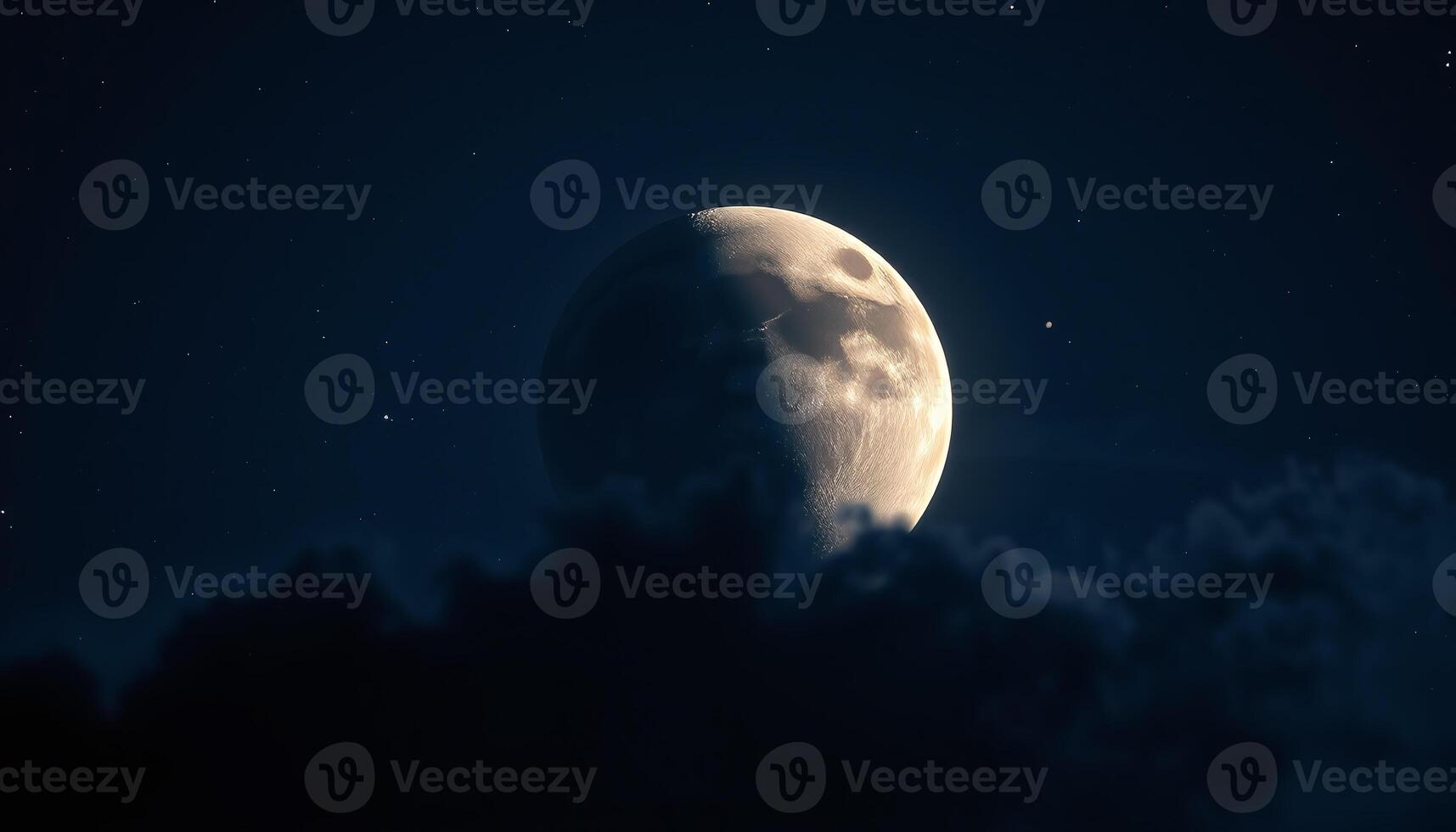 The moon is seen in the night sky with clouds photo