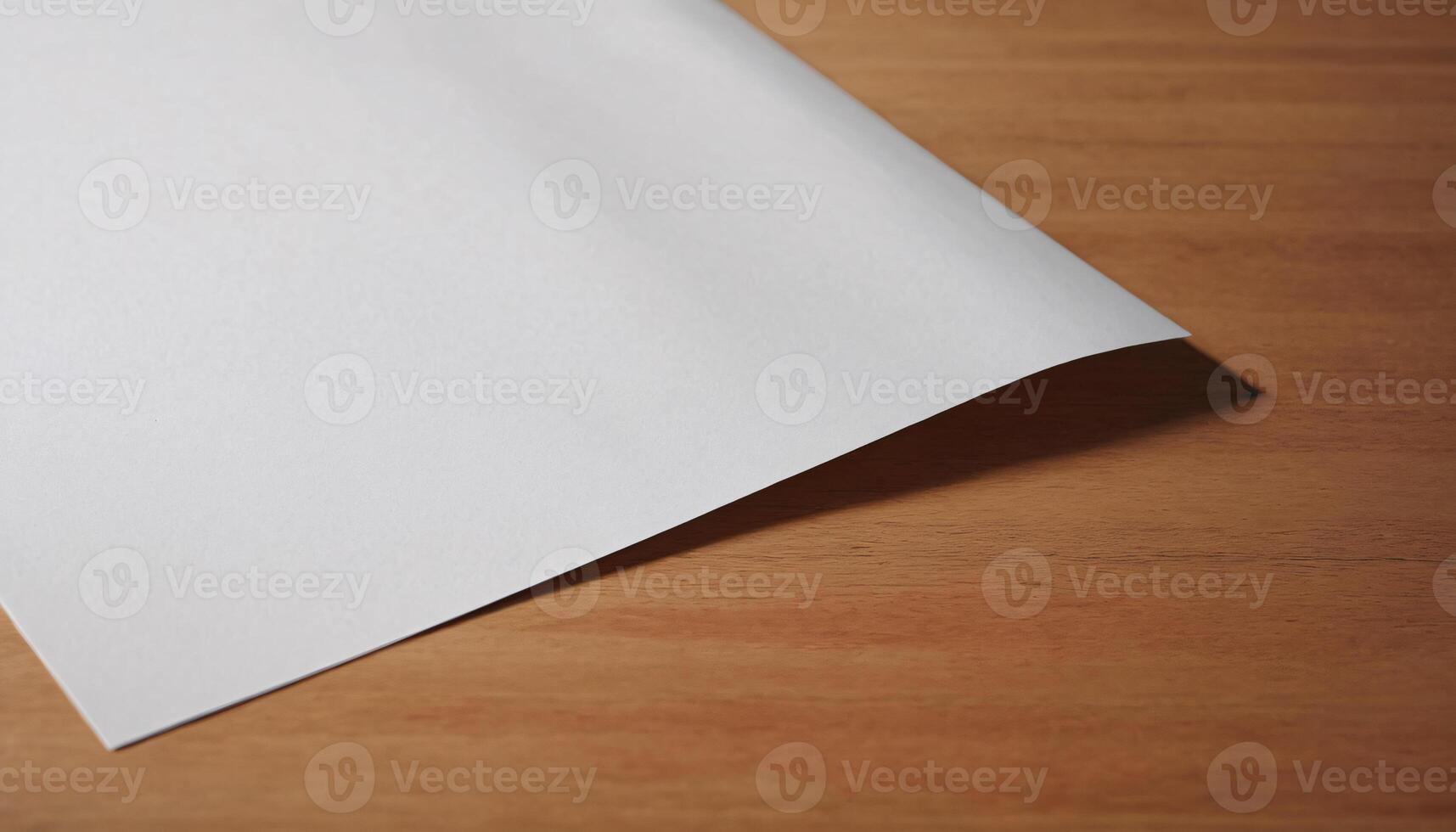 A sheet of paper on a wooden table photo