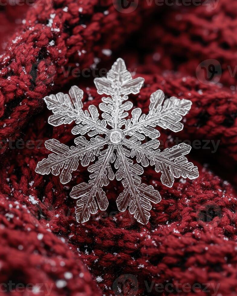 Intricate snowflake crystal on red background photo