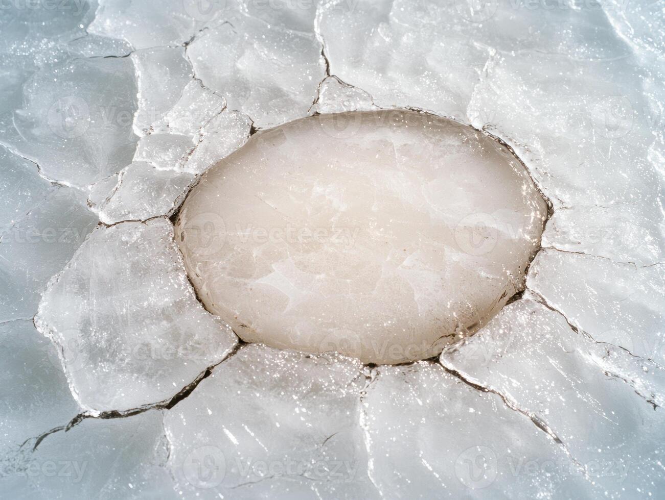 Frozen lake with cracked ice surface photo