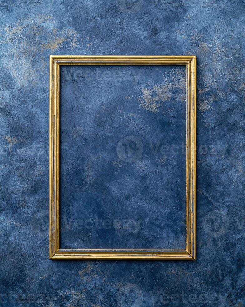 empty golden frame on blue textured background photo