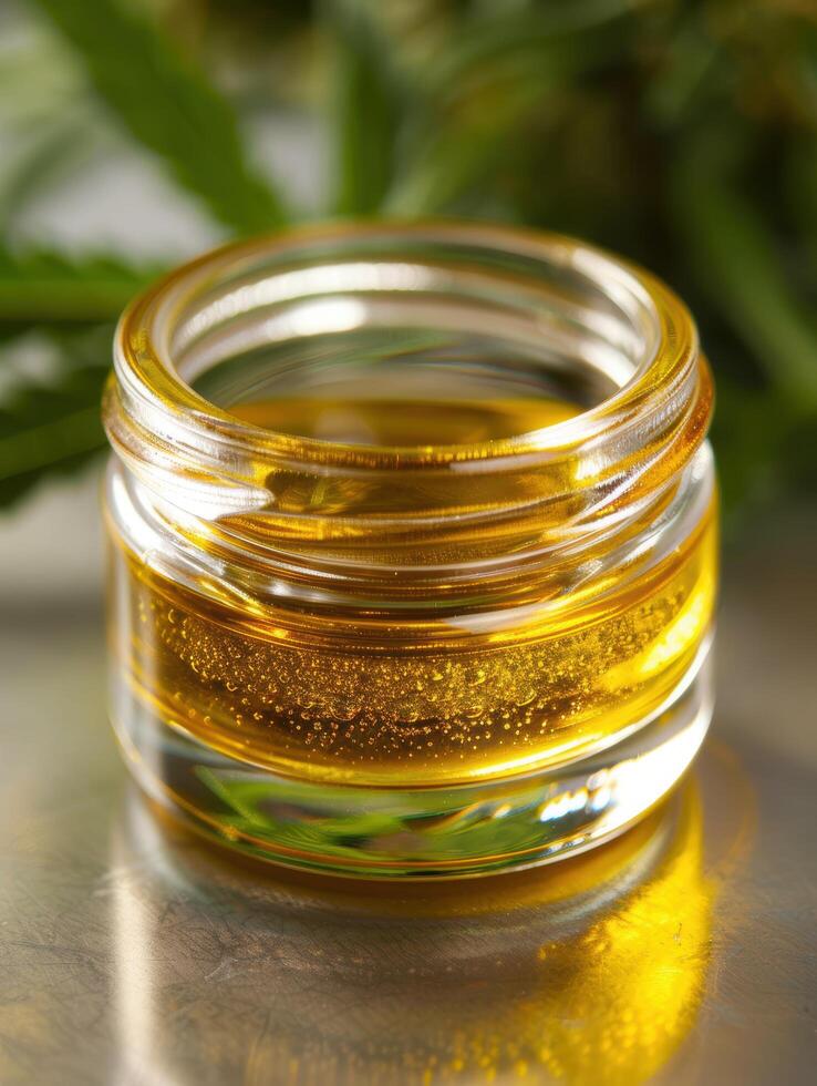 Close up of golden honey in glass jar photo
