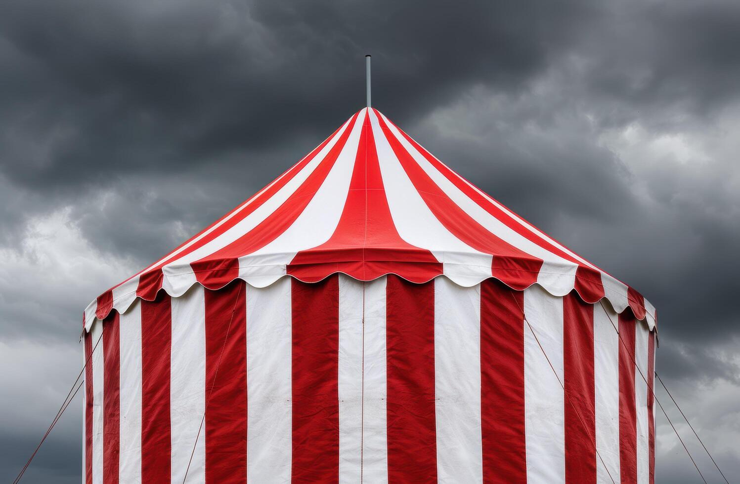 Dramatic circus tent against stormy sky photo