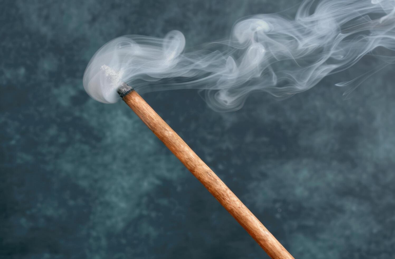 Smoldering wooden match stick photo