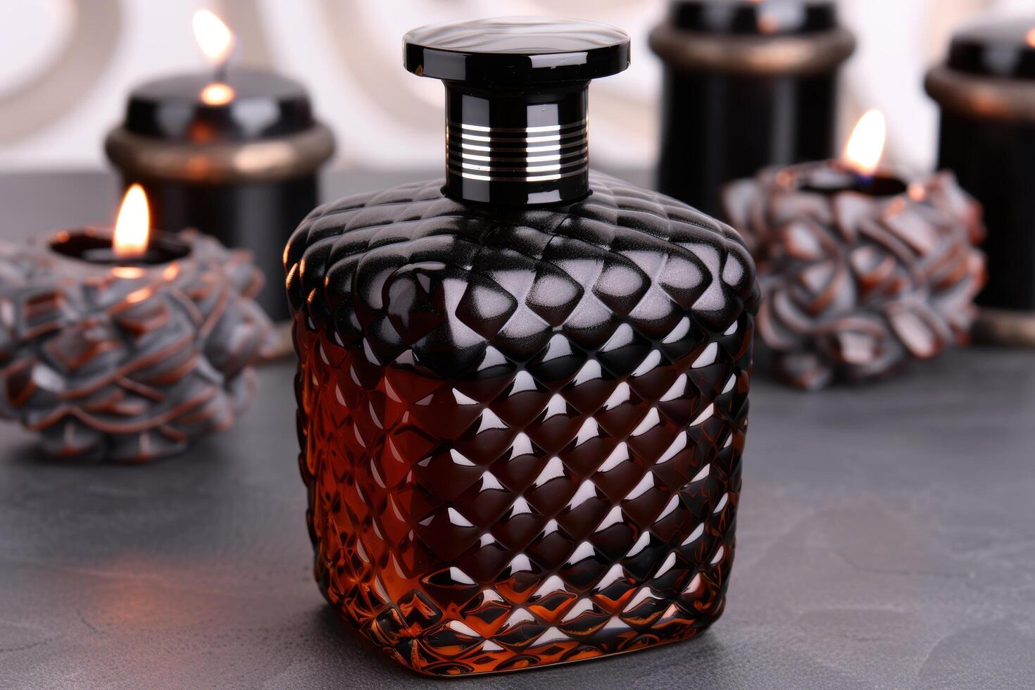 elegant black glass perfume bottle with intricate pattern photo