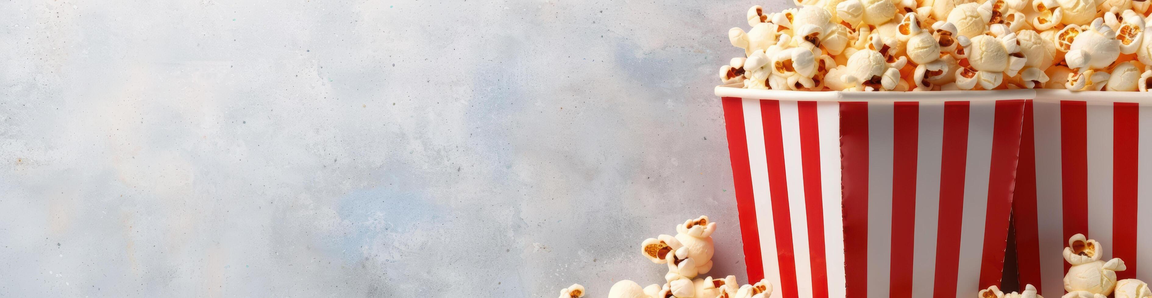 Delicious popcorn in a striped box photo