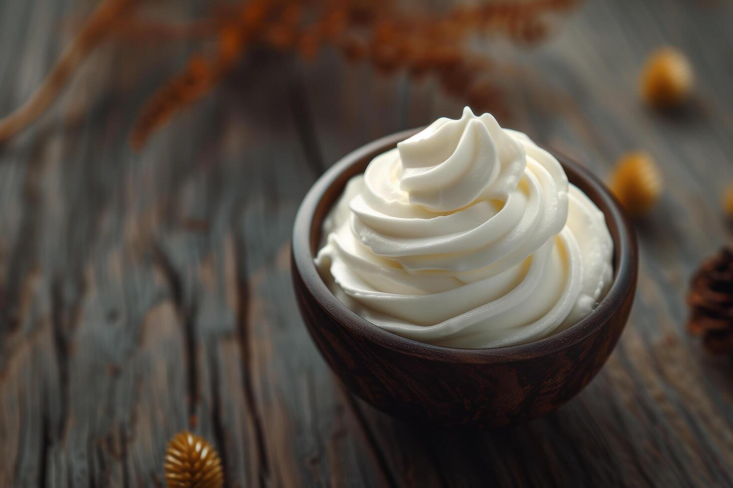 Creamy white whipped cream topping in a dark cup photo