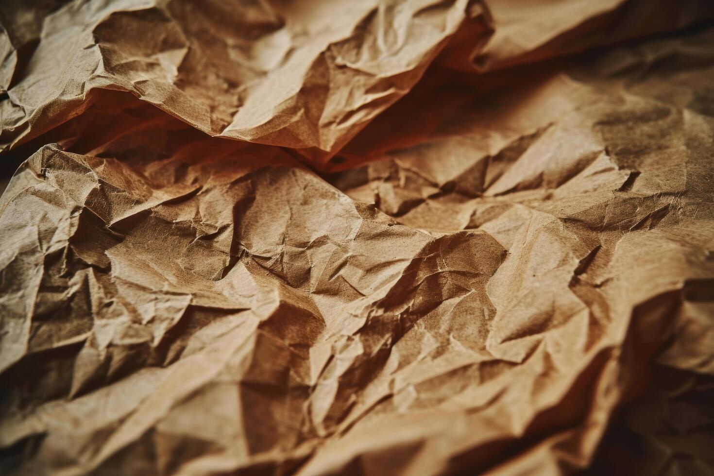 Crumpled brown paper texture background photo