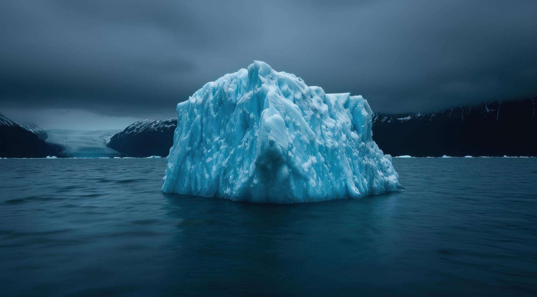 Majestic iceberg floating in dark waters photo