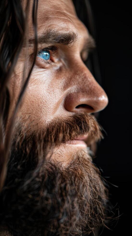 close up portrait of a rugged man with a thick beard photo