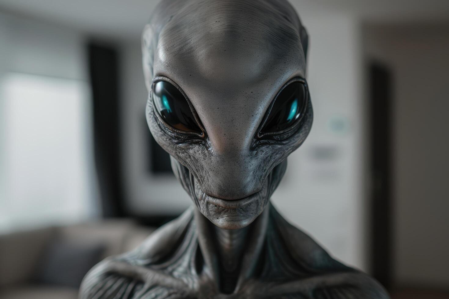 Close up of an alien face with large black eyes and wrinkled skin photo