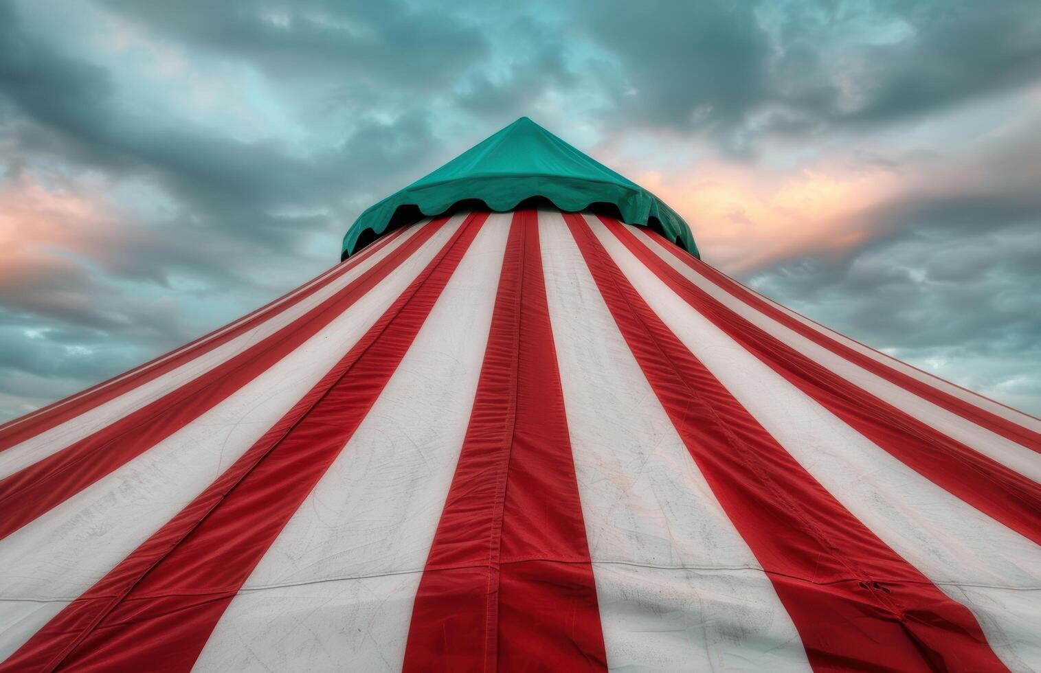 Vibrant circus tent against dramatic sky photo
