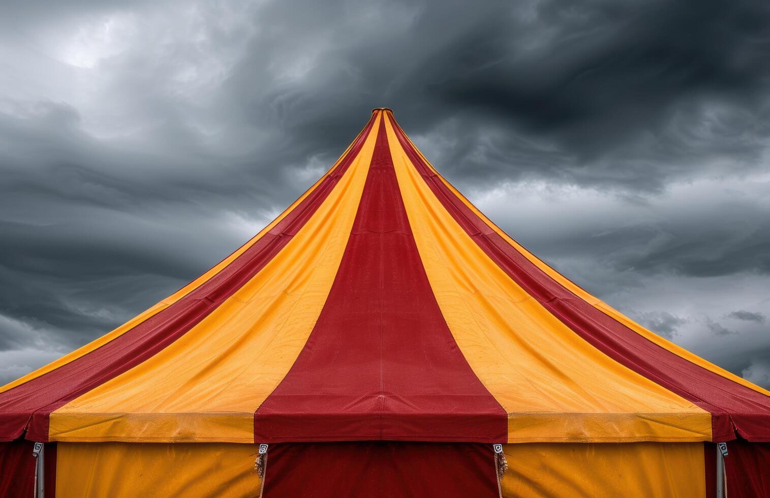 Vibrant circus tent against stormy sky photo