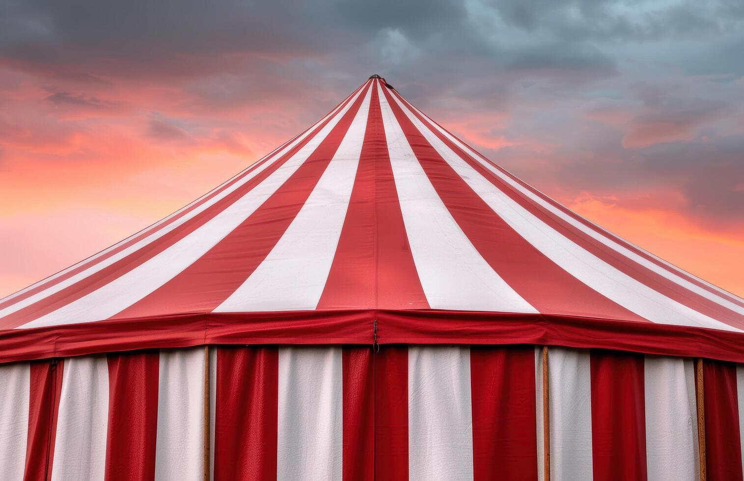 Vibrant circus tent against dramatic sky photo