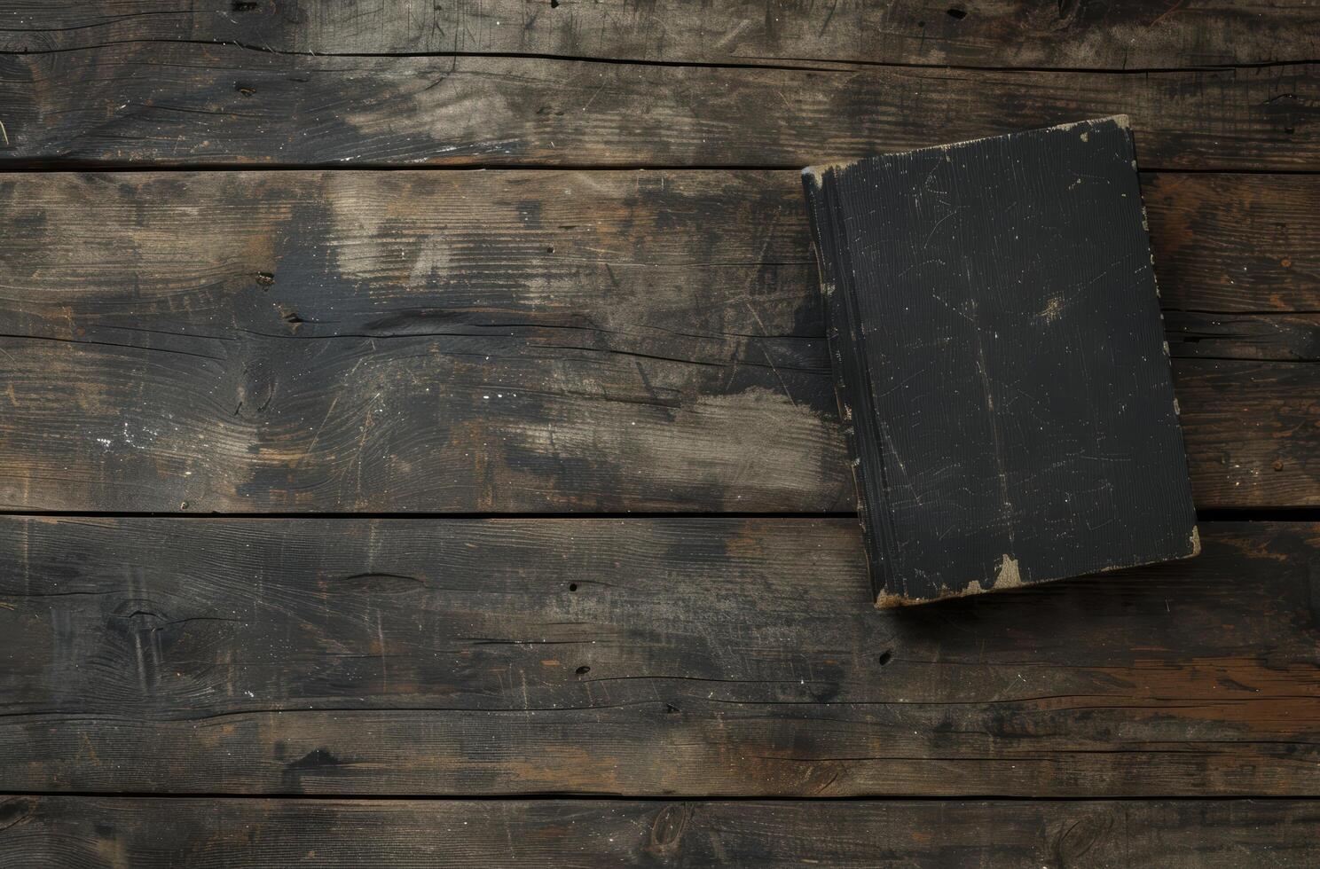old worn book on rustic wooden background photo