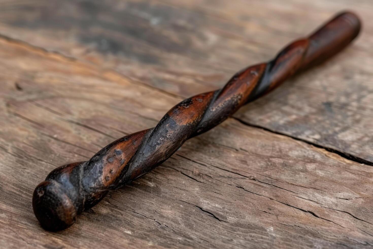 Twisted wooden stick on weathered wooden surface photo