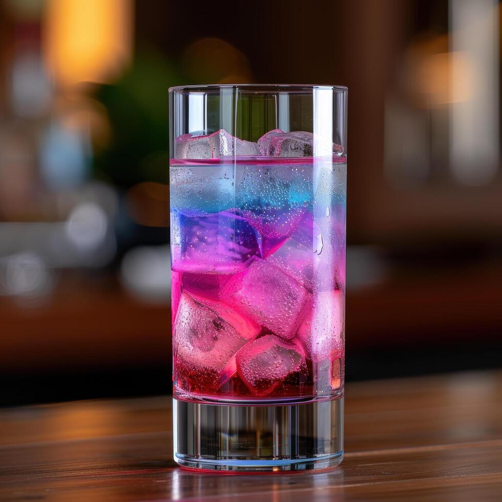 Colorful cocktail with ice cubes photo