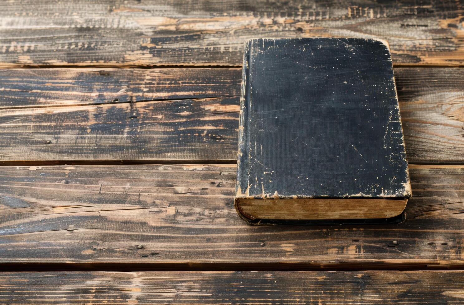 Vintage book on wooden table photo