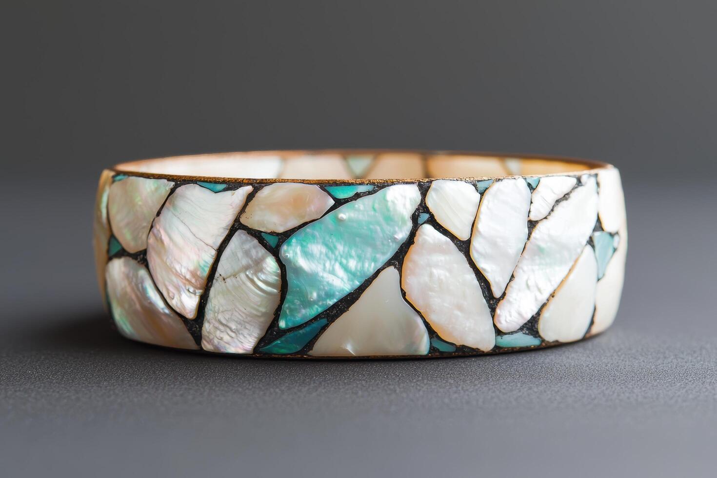 Decorative mosaic bracelet with natural shell and stone patterns photo