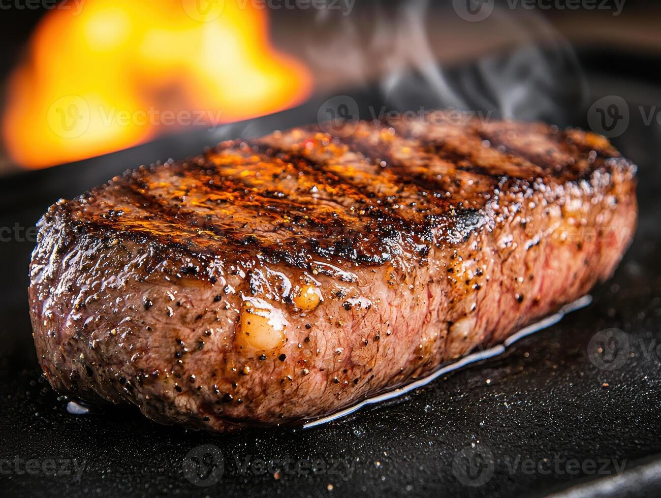 Sizzling steak on a fiery grill photo
